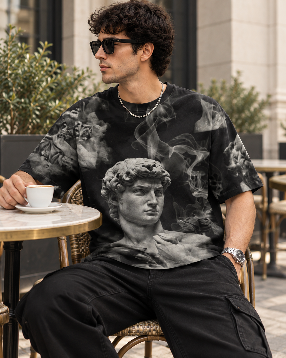 Dark Aesthetic Smoke All-Over Print Unisex Oversized T-Shirt – 240 GSM Heavyweight Streetwear — seated lifestyle photo