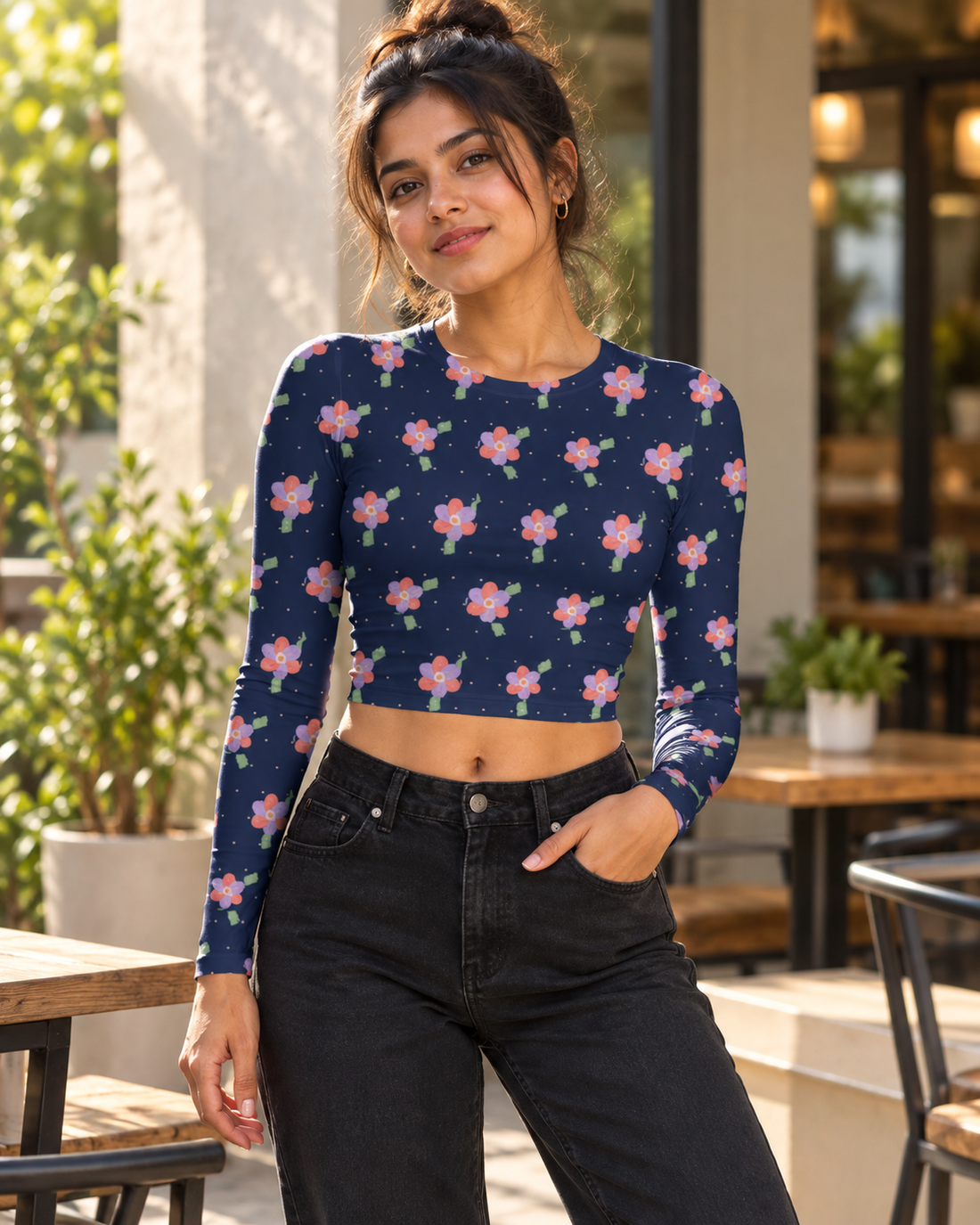 Navy floral AOP full sleeve crop top worn in a café lifestyle setting