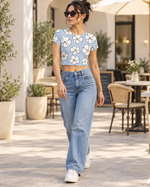 Women's Light Blue Floral Crop Top | White Flower Petal Print | Short Sleeve Casual Summer Top — walk lifestyle photo