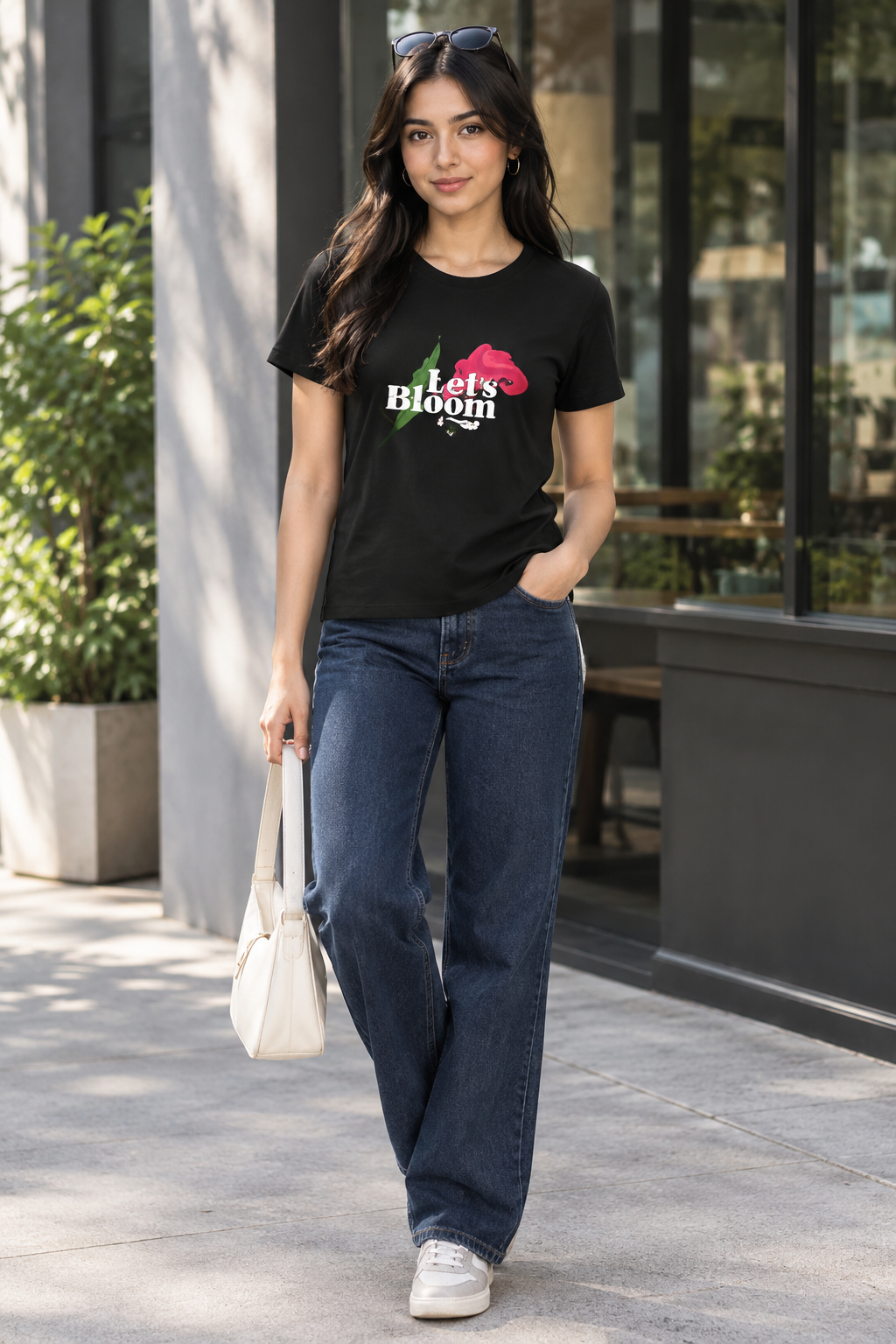 Let's Bloom Floral women's black T-shirt lifestyle photo with tulip graphic