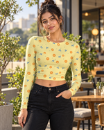 Pale yellow printed AOP full sleeve crop top worn in a café lifestyle setting