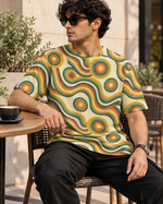 Vintage Swirl All-Over Print Unisex Oversized T-Shirt – 240 GSM Heavyweight Streetwear — seated lifestyle photo