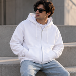 White unisex zip hoodie lifestyle front view